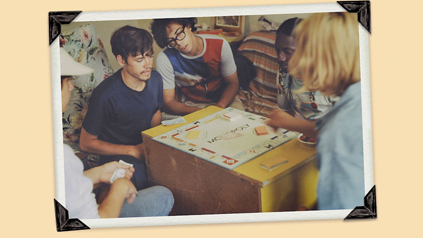 LGBTQ+ students playing board game